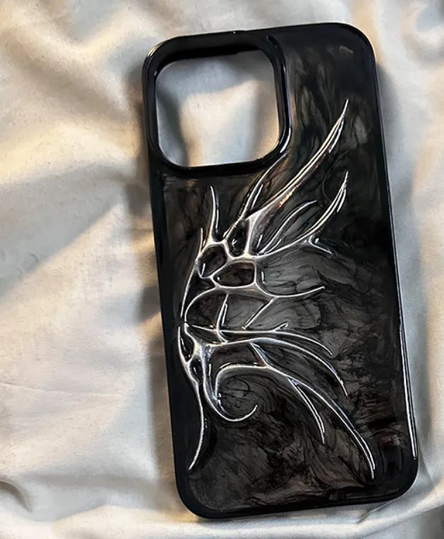 Black iPhone case with a blurred, three-dimensional wings design on the back.