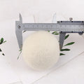 Set of natural wool drying balls with cotton storage bag for laundry static reduction