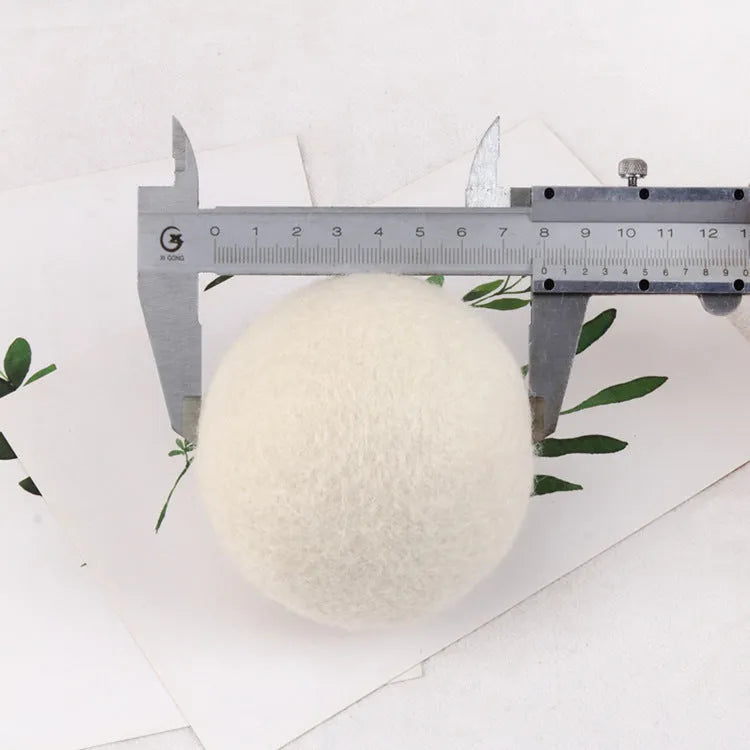 Set of natural wool drying balls with cotton storage bag for laundry static reduction
