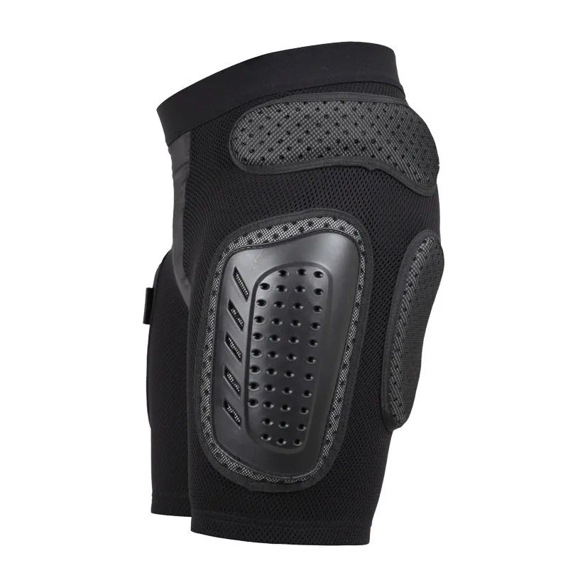 Black cycling hip protection pants with integrated pads, showing hook and loop fastener closures.