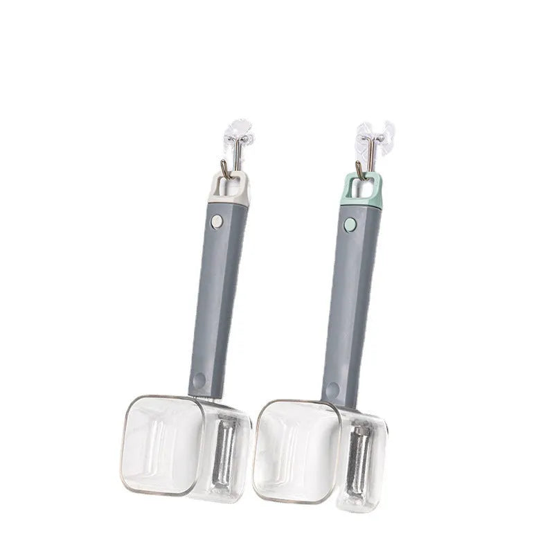 Creative green stainless steel and plastic vegetable peeler on a kitchen surface.