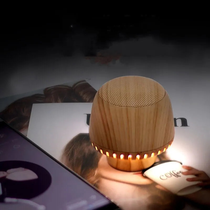 Portable mushroom-shaped Bluetooth speaker with LED night light, compact 55mm cube, in black colour