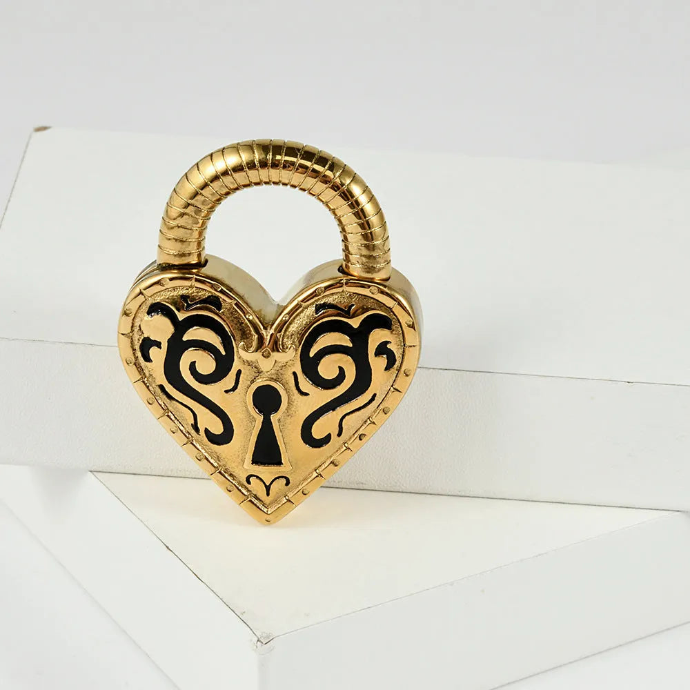 Heart-shaped stainless steel ear piercings in gold and steel colour options showing front and back views