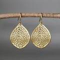 Gold retro leaf hollow drop pendant earrings made from alloy.