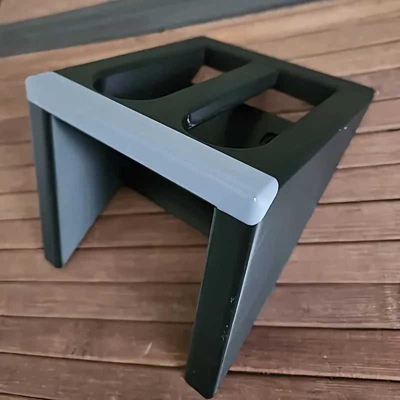 Black plastic punk-style pistol display stand for toy guns.