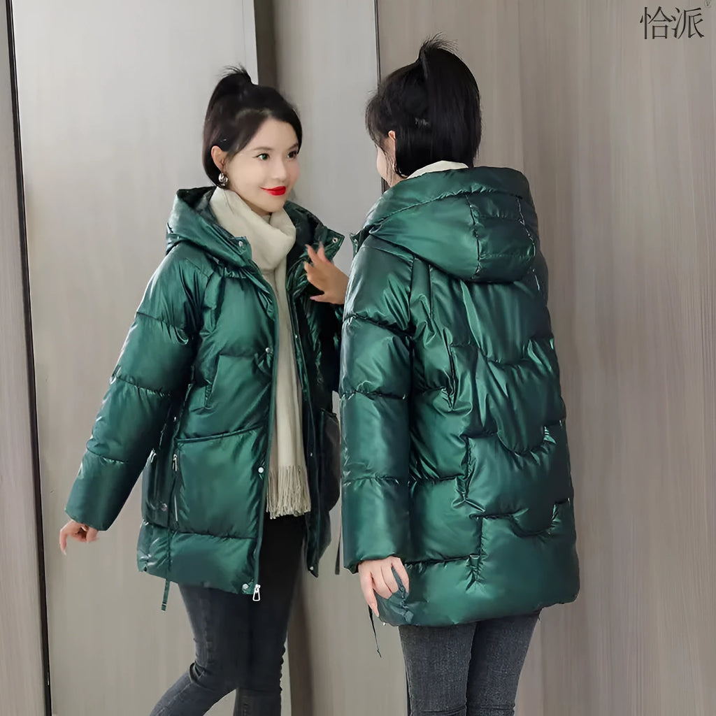 A woman's loose-fit hooded winter jacket in a poly-cotton blend, shown in a choice of colours including black and champagne.