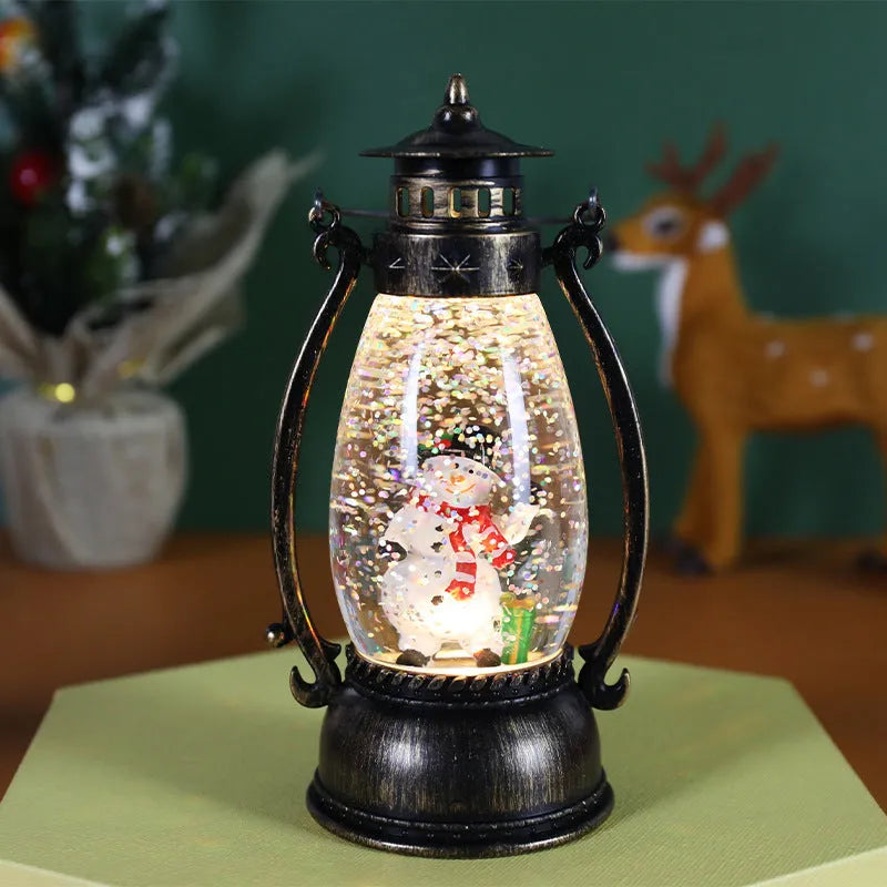 Clear plastic crystal ball LED portable oil lamp with a decorative snowman figure inside on a table.