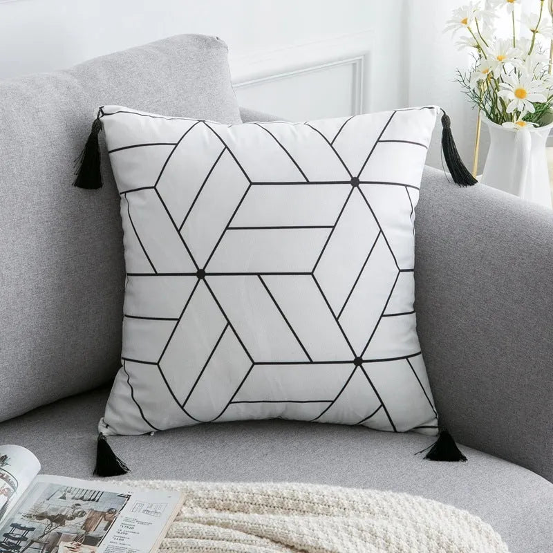 Bohemian national style polyester cushion cover in light grey on a sofa.