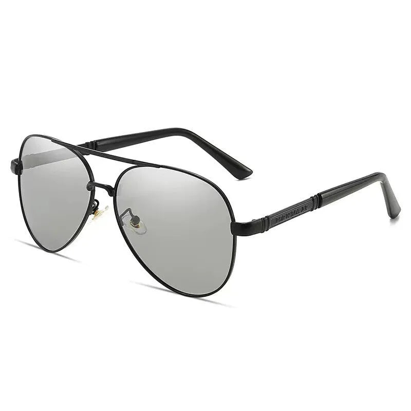 Gold metal framed polarised sunglasses for men with dragon motif on arms and grey lenses.