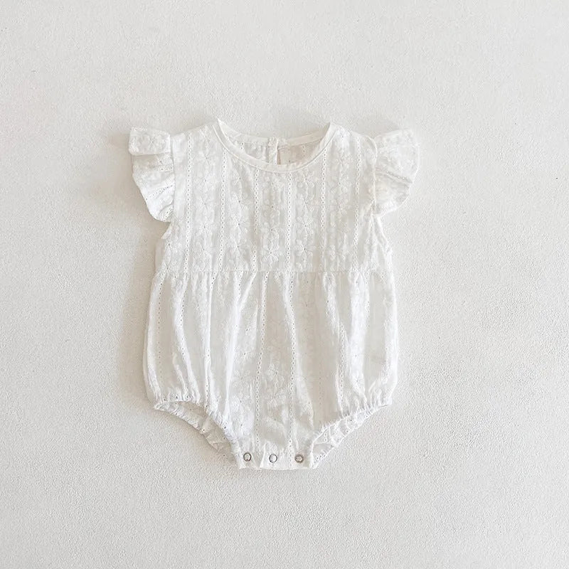 Creamy white cotton lace triangle jumpsuit for baby girl with short sleeves and button closure