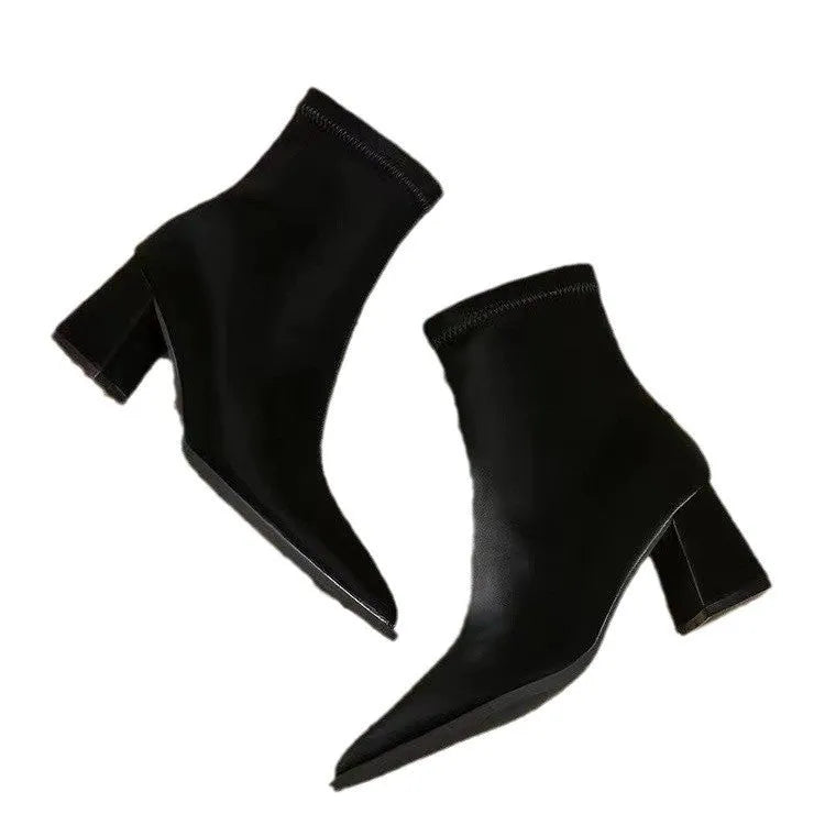 Women's khaki pointed toe ankle boots with a wedge heel on a white background.
