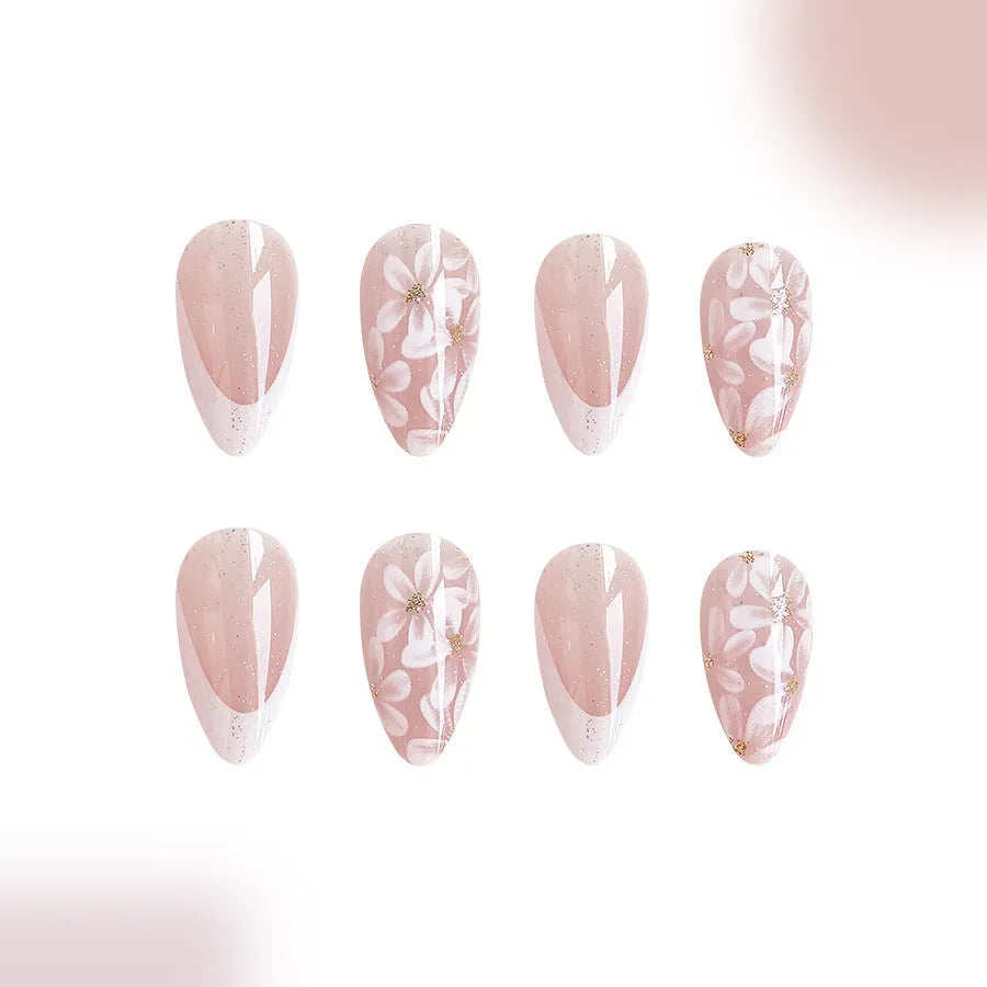 Short glossy almond French style false nails with glittering flower pattern in colour C625