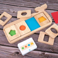 Wooden early education geometry puzzle with colour shape matching, trolley design, on a white background