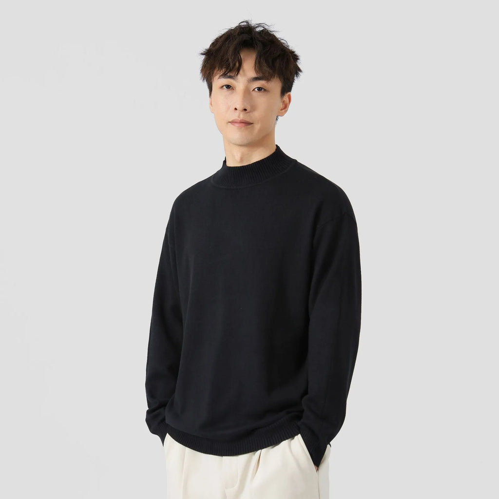 Man wearing a loose-fit army green long-sleeved pullover sweater for casual wear.