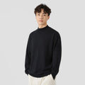 Man wearing a loose-fit army green long-sleeved pullover sweater for casual wear.