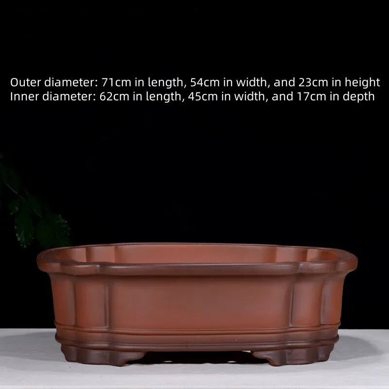 Large antique finish purple clay rectangular flowerpot with carved Chinese tree stump, pine, cypress, and fruit designs.