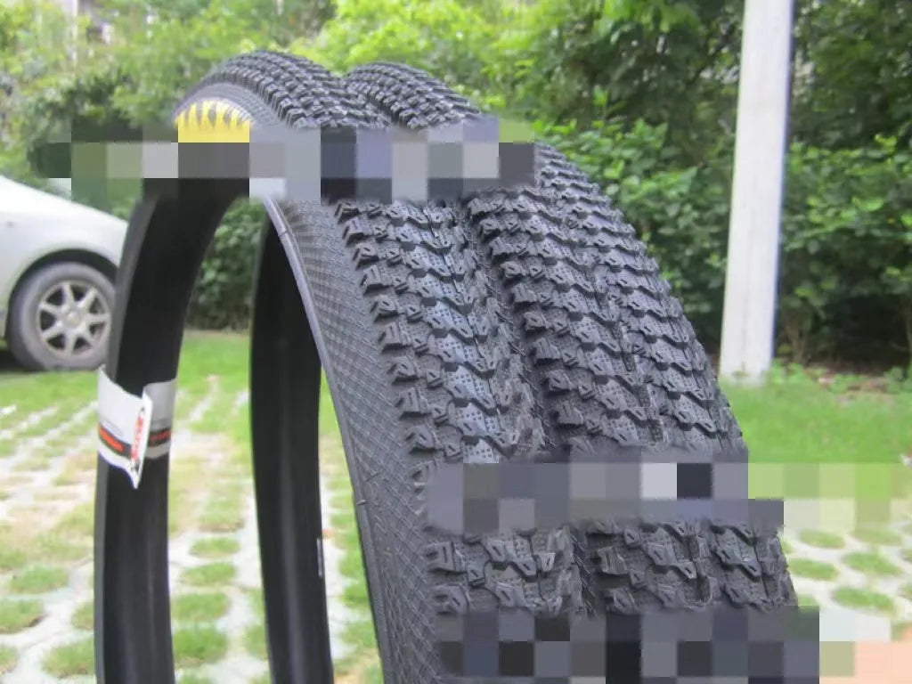 Ultralight black mountain bike tyre with white label option, showing tread pattern and size markings.