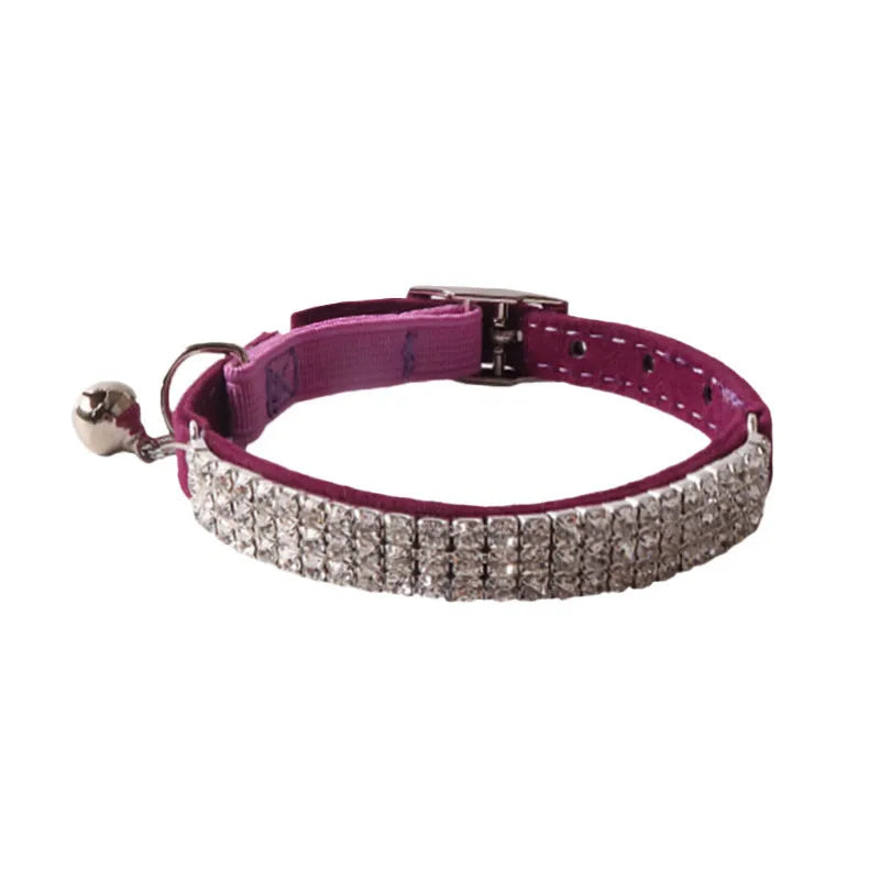 Elastic buckle cat collar in flocking fabric with gang drill detail, shown in multiple colours.