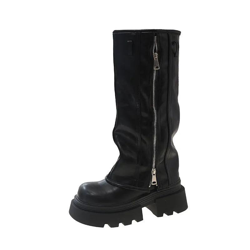Black platform muffin pants Martin boots with high socks and a square rubber sole.