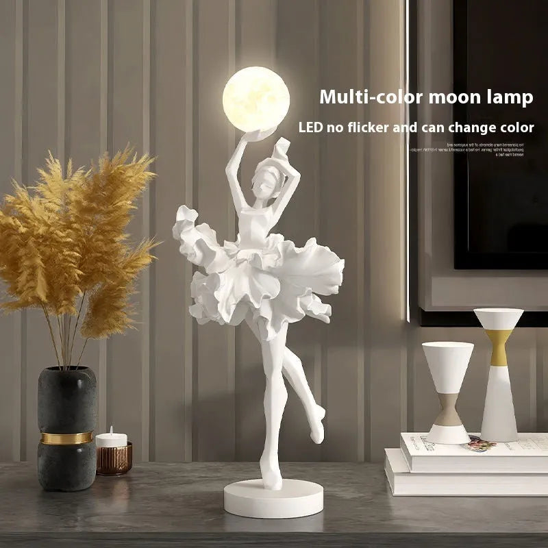 Modern art girl style resin night light with USB charging cable in black gold colour.