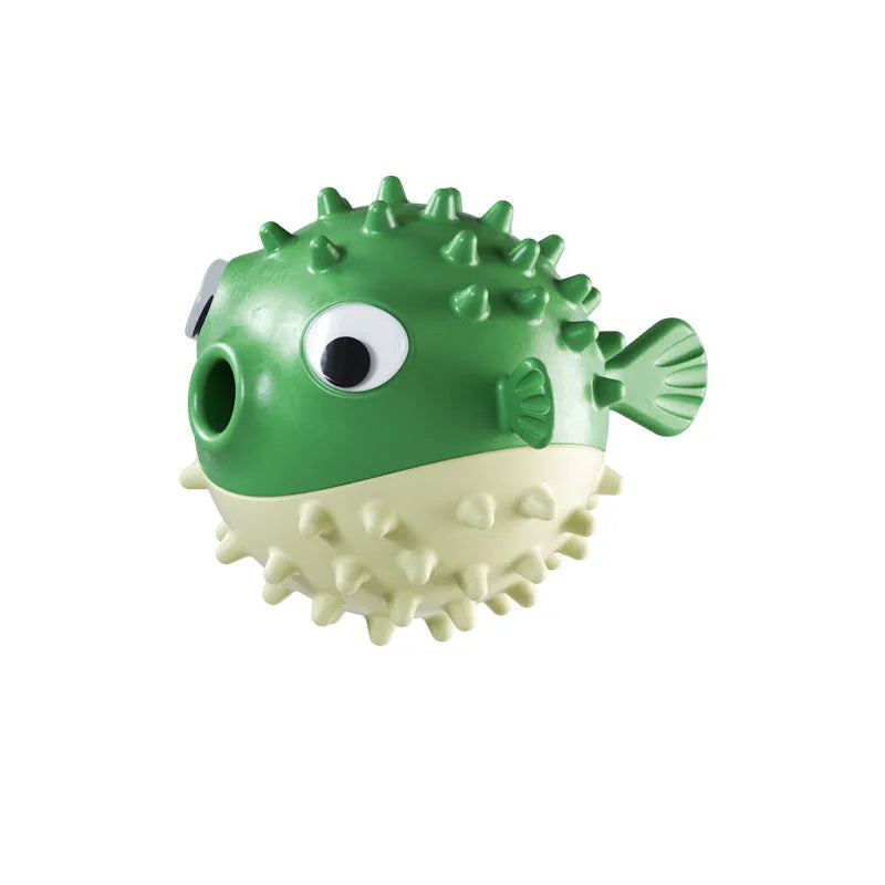 Green fish-shaped interactive dog toy with textured surface for treat dispensing and chewing.