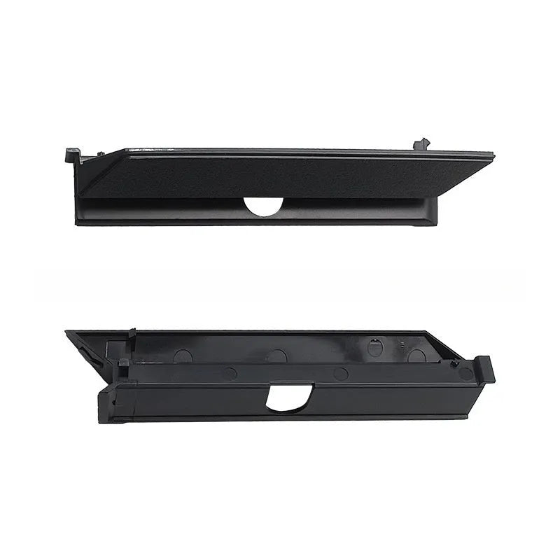 Black PS4 Pro hard drive bottom cover and internal service parts including a baffle and block strip.