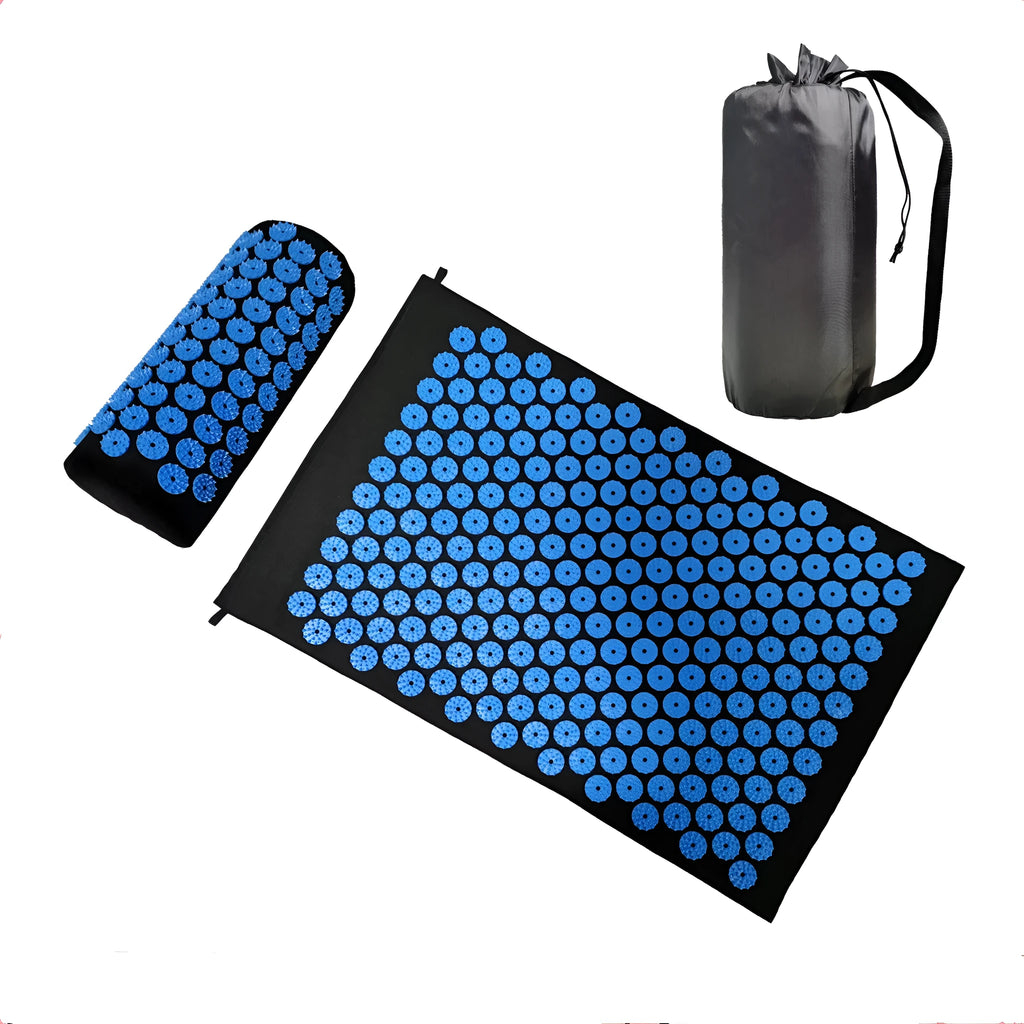 Black and blue acupuncture massage mat set with cushion and headrest on floor for yoga and massage