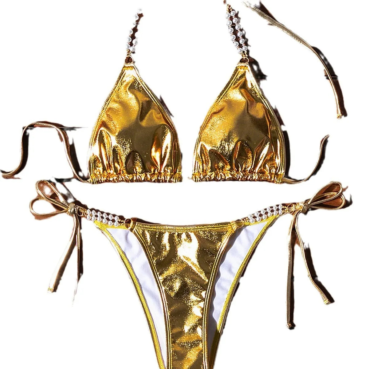 Gold women's halter lace-up bikini swimsuit with pearl chain detailing on mannequin
