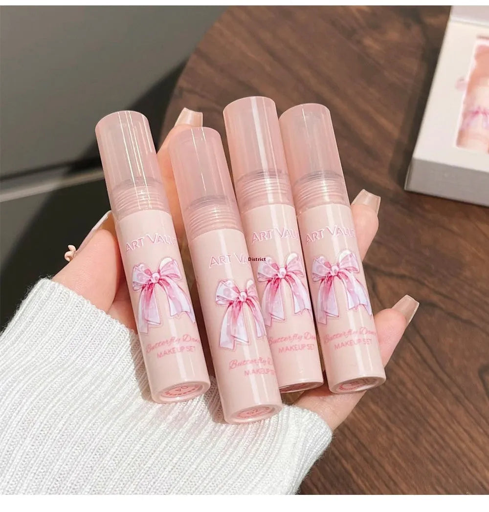 Butterfly Box makeup set showing pink lip mud, powder blusher, and necklace