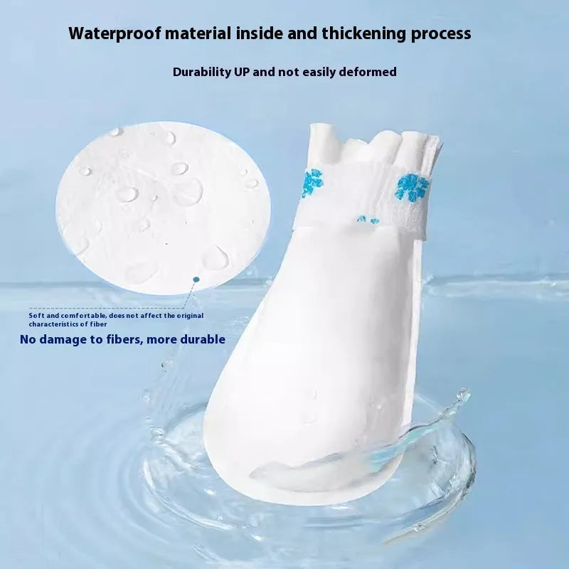 White disposable waterproof pet shoe covers with non-slip soles in S and M sizes