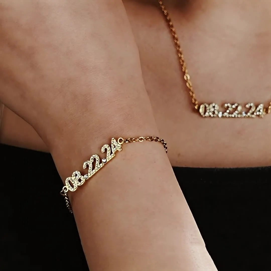 Stainless steel digital bracelet with diamond set numbers on display, shown in a gold colour option.