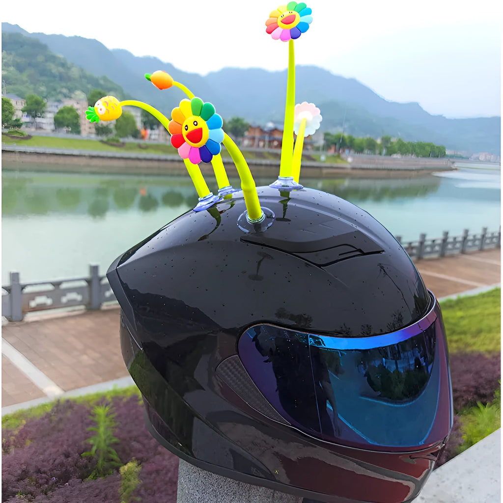 Yellow silicone swinging sunflower decoration with suction cup for helmet attachment.