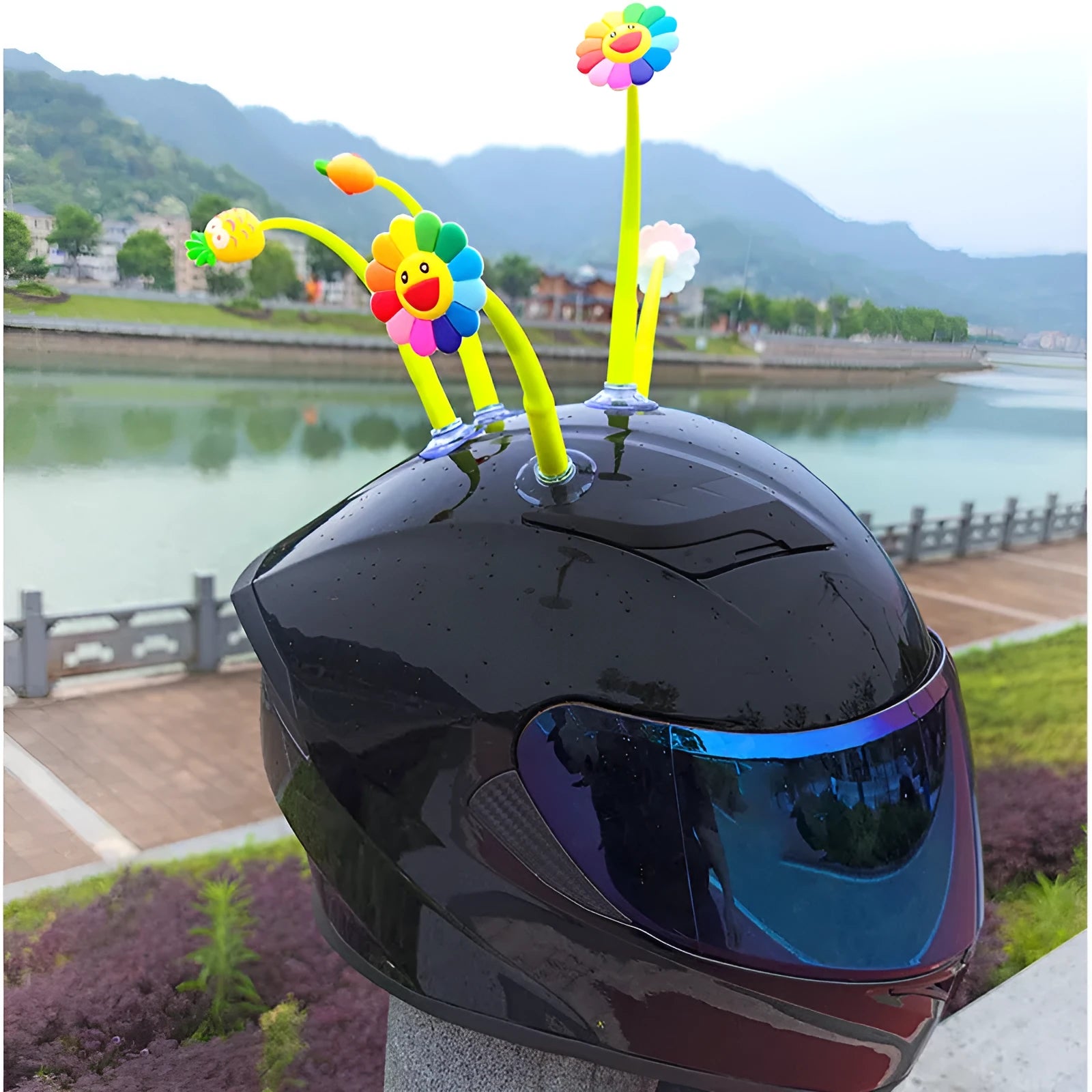 Yellow silicone swinging sunflower decoration with suction cup for helmet attachment.