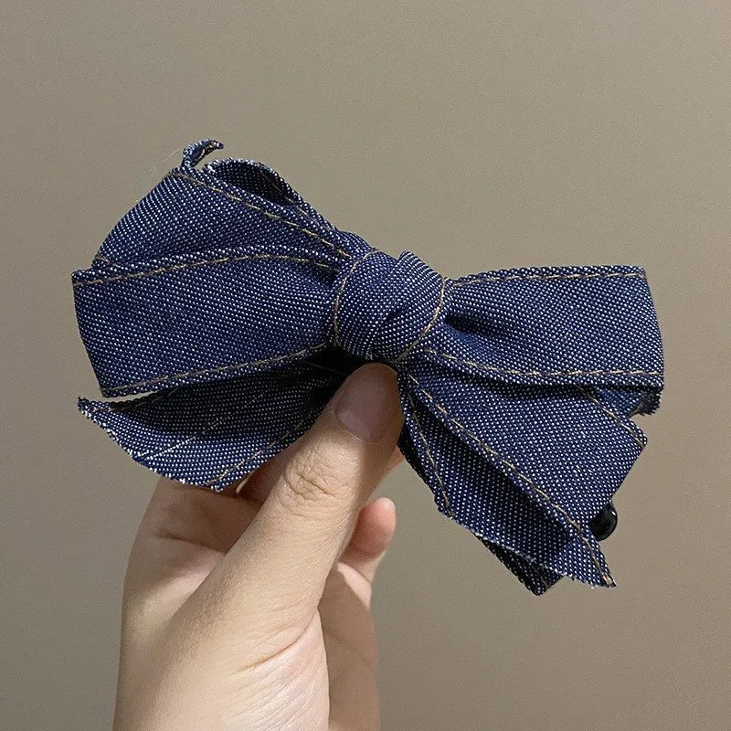 Blue denim bow barrette with cloth bow and metal clip on women back head hair