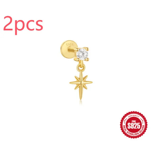 S925 sterling silver ear stud with XINGX inlaid tassel design in a gold colour.