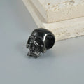 Stainless steel hollow skull and Buddha geometric design earrings in hip-hop style.