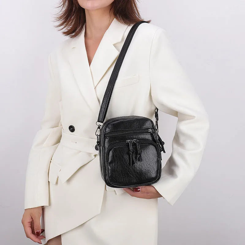 Soft PU leather mini shoulder bag with chain detail in black and brown colour options