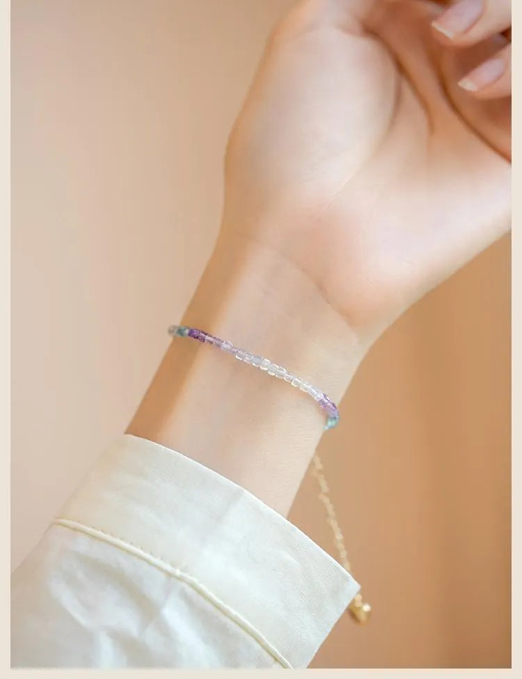 Handmade women's bracelet with geometric copper links and rainbow fluorite decoration