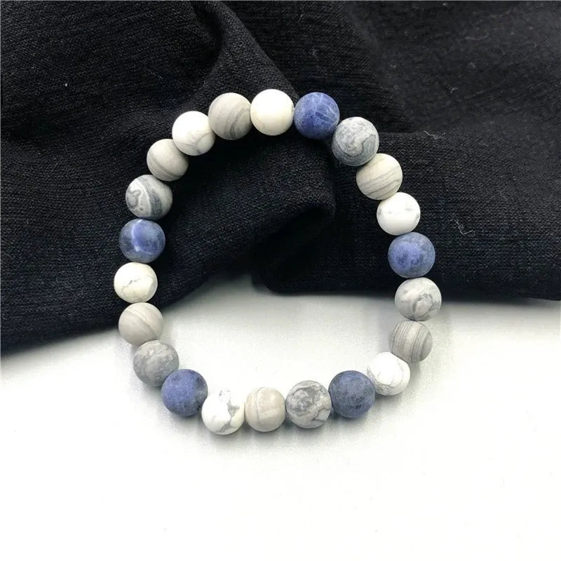 Handmade planet stone men's bracelet in U-shape, S228 Universe Wind design on wrist.