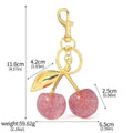 Zinc alloy cherry-shaped key pendant in pink colour with three-dimensional design for car keys or bag charms