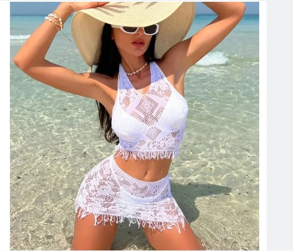 Women's white two-piece bikini swimsuit with lace briefs and matching tassel skirt beach cover-up