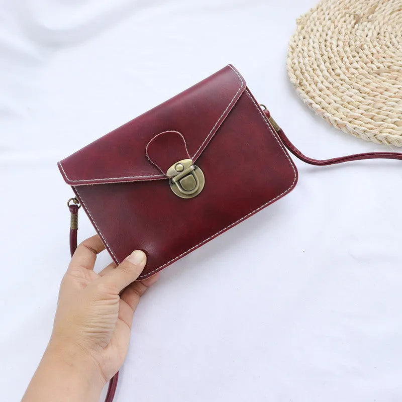 Retro soft surface shoulder messenger bag in cross square shape with flap closure