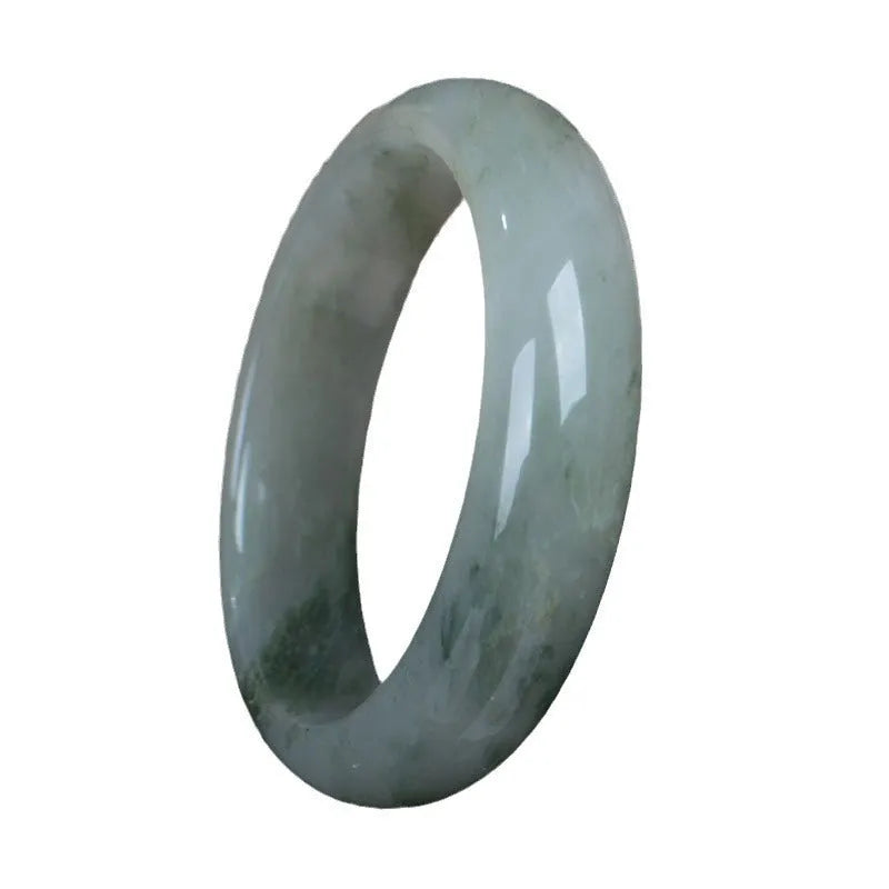Natural Jinsi Jade Chinese style bracelet in a bangle shape on a plain background.