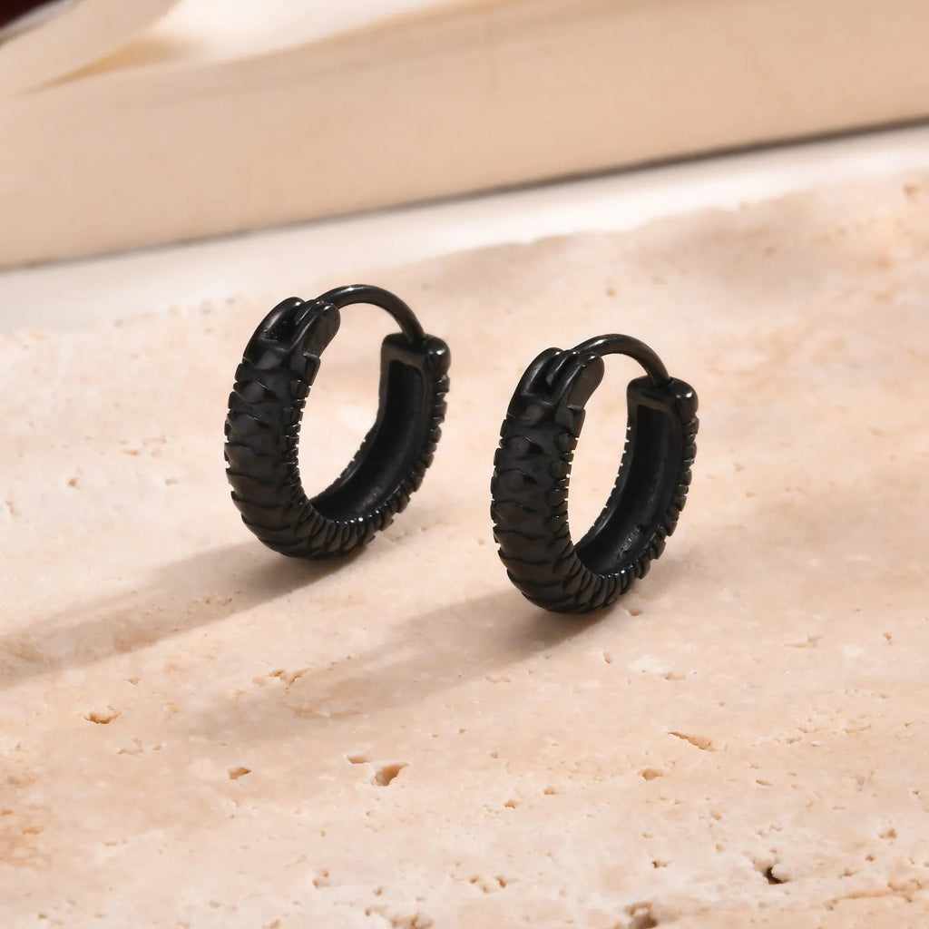 A pair of stainless steel stud earrings for men with a snake pattern, shown in black and gold colour options.