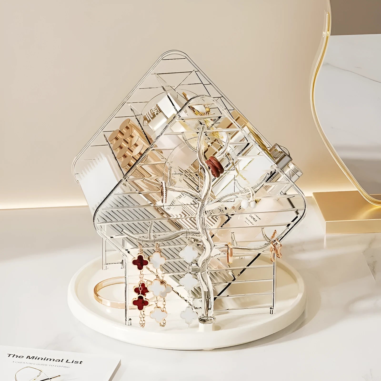 Clear and amber gold rotating plastic cosmetics storage box organiser on a table.