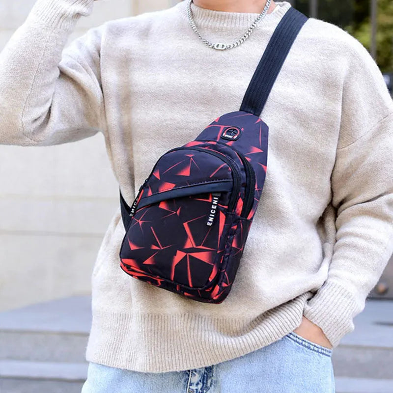 Blue Oxford cloth crossbody messenger bag with a strap, showing a front earphone hole and zipper closure.