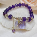 Purple amethyst crystal bracelet with ethnic money bag pendant and peace buckle closure