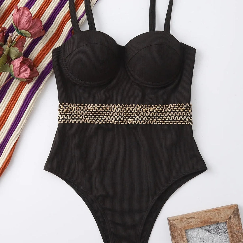 Black one-piece swimsuit for women with adjustable shoulder straps on a mannequin.
