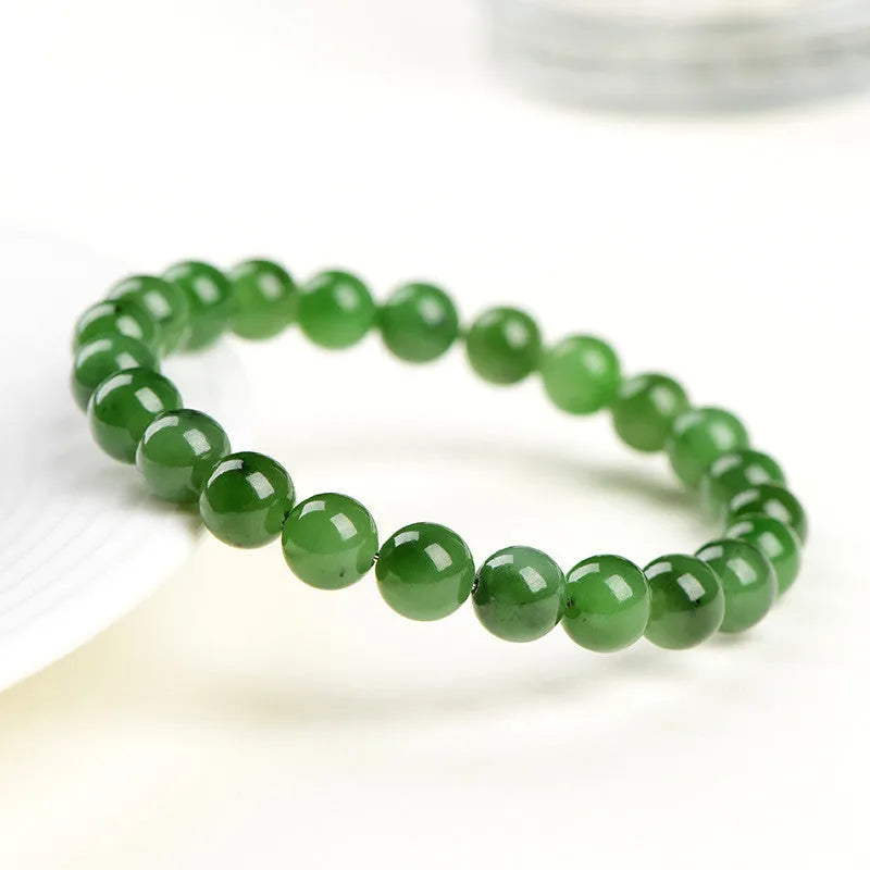 Natural Jasper bead bracelet with polished Russian Jasper beads in multiple sizes on a white background.