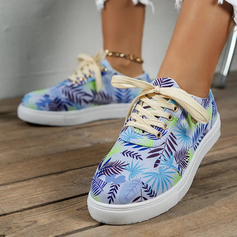 Light blue women's canvas lace-up flats with graffiti leaf print and round toe